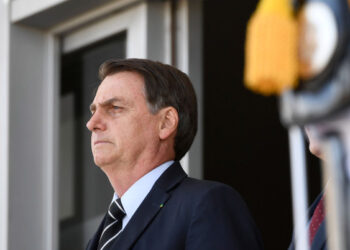 Brazilian President Jair Bolsonaro attends the changing of the guard ceremony at Planalto Palace in Brasilia, on July 31, 2019. - Bolsonaro met with US Secretary of Commerce Wilbur Ross Wednesday in Brasilia. (Photo by EVARISTO SA / AFP)