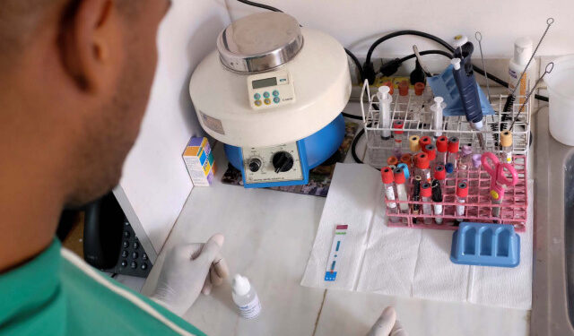 A nurse waits for the result of an HIV test at the lab of the NGO "Accion Solidaria" (Solidarity Action) in Caracas, Venezuela, November 28, 2018. Picture taken November 28, 2018. REUTERS/Marco Bello