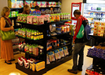 People shop inside a convenience store at a five-star hotel in Caracas, Venezuela October 12, 2018. Picture taken October 12, 2018. REUTERS/Marco Bello