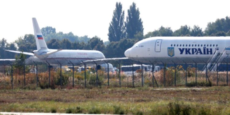 A view shows a Russian plane (L) ahead of a prisoner exchange between Russia and Ukraine, at Borispil International Airport outside Kiev, Ukraine September 7, 2019. REUTERS/Gleb Garanich