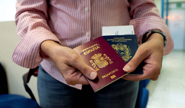 Mariana Elias, 27, shows her Venezuelan and Spanish passports at the Simon Bolivar International Airport, La Guaira, Venezuela, January 14, 2019. Before moving to Barcelona in January, Elias spent years in Caracas doing two degrees in chemical and production engineering. Her reason for moving to Barcelona was straightforward: "My job ambitions. As I really prepared myself academically, I wanted to have the opportunity in the long-term to progress and upgrade. I wasn't able to see that in Venezuela right now." REUTERS/Ana Maria Arevalo Gosen  SEARCH "AREVALO SPAIN" FOR THIS STORY. SEARCH "WIDER IMAGE" FOR ALL STORIES.