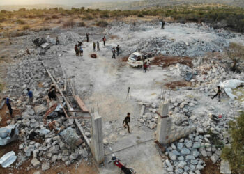 An aerial view taken on on October 27, 2019 shows the site that was hit by helicopter gunfire which reportedly killed nine people near the northwestern Syrian village of Barisha in the Idlib province along the border with Turkey, where "groups linked to the Islamic State (IS) group" were present, according to a Britain-based war monitor with sources inside Syria. - The helicopters targeted a home and a car on the outskirts of Barisha, the Syrian Observatory for Human Rights said, after US media said IS leader Abu Bakr al-Baghdadi was believed to be dead following a US military raid in the same province. Observatory chief Rami Abdel Rahman said the helicopters likely belonged to the US-led military coalition that has been fighting the extremist group in Syria. (Photo by Omar HAJ KADOUR / AFP)