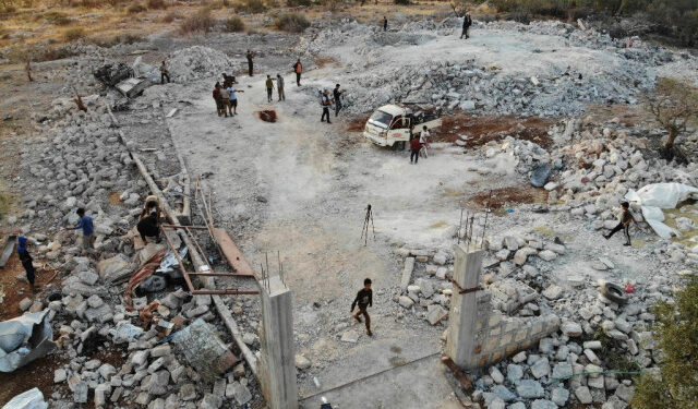 An aerial view taken on on October 27, 2019 shows the site that was hit by helicopter gunfire which reportedly killed nine people near the northwestern Syrian village of Barisha in the Idlib province along the border with Turkey, where "groups linked to the Islamic State (IS) group" were present, according to a Britain-based war monitor with sources inside Syria. - The helicopters targeted a home and a car on the outskirts of Barisha, the Syrian Observatory for Human Rights said, after US media said IS leader Abu Bakr al-Baghdadi was believed to be dead following a US military raid in the same province. Observatory chief Rami Abdel Rahman said the helicopters likely belonged to the US-led military coalition that has been fighting the extremist group in Syria. (Photo by Omar HAJ KADOUR / AFP)