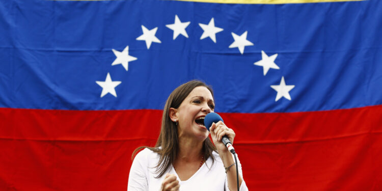Opposition deputy Maria Corina Machado speaks during a rally against Nicolas Maduro's government in Caracas March 3, 2014. Jailed Venezuelan opposition leader Leopoldo Lopez urged sympathizers on Monday to maintain street protests against President Nicolas Maduro as the country's foreign minister prepared to meet the United Nations Secretary General. REUTERS/Carlos Garcia Rawlins (VENEZUELA - Tags: POLITICS CIVIL UNREST) - RTR3FZXR