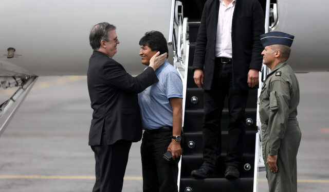 Bolivia's ousted President Evo Morales is welcomed by Mexico's Foreign Minister Marcelo Ebrard during his arrival to take asylum in Mexico, in Mexico City, Mexico, November 12, 2019. REUTERS/Edgard Garrido