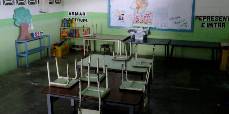 Empty desks are seen in a classroom on the first day of school  in Caucagua  Venezuela September 17  2018  REUTERS Marco Bello