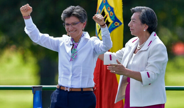 Bogota's incoming Mayor Claudia Lopez raises her arms during her inauguration ceremony in Bogota on January 1, 2020. (Photo by Raul ARBOLEDA / AFP)