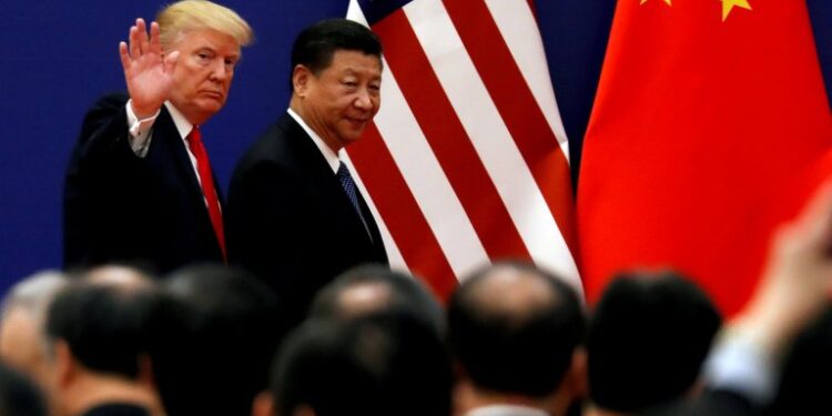 FILE PHOTO: U.S. President Donald Trump and China's President Xi Jinping meet business leaders at the Great Hall of the People in Beijing, China, November 9, 2017. REUTERS/Damir Sagolj/File Photo