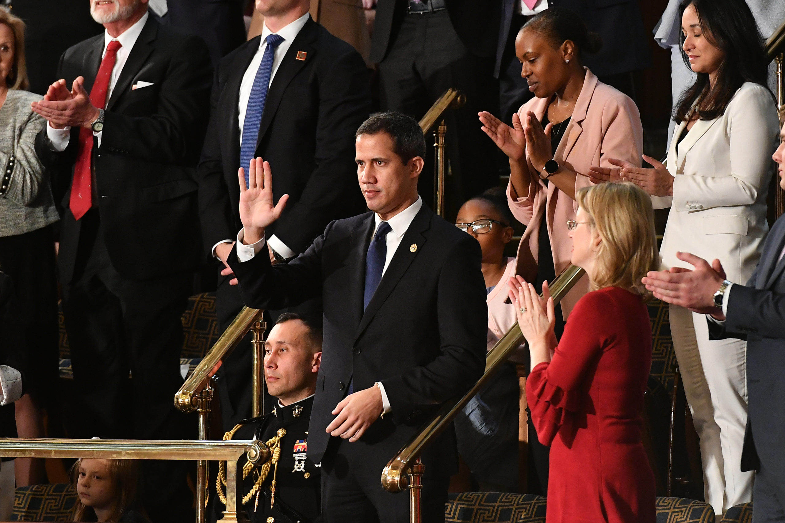 Venezuelan opposition leader Juan Guaido (C) waves as he is acknowledged by US President Donald Trump during his the State of the Union address at the US Capitol in Washington, DC, on February 4, 2020. (Photo by MANDEL NGAN / AFP)