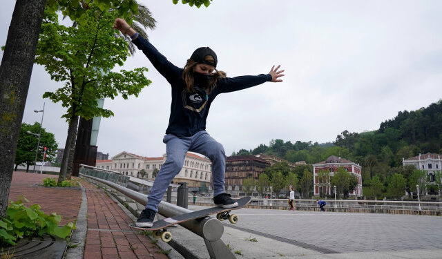 Egoitz Bijueska, 9, grinds a rail on a skateboard at the Guggenheim Museum, on his first day out in six weeks after restrictions were partially lifted for children, during the coronavirus disease (COVID-19) outbreak in Bilbao, Spain, April 26, 2020. REUTERS/Vincent West