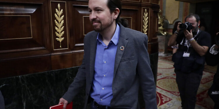 Podemos party leader Pablo Iglesias arrives at the Spanish Parliament in Madrid, Spain, Tuesday, Jan. 7, 2020. Spanish lawmakers are due to vote Tuesday on whether to endorse the formation of a Socialist-led coalition government, ending almost a year of political limbo for the eurozone's fourth-largest economy. (AP Photo/Manu Fernandez)