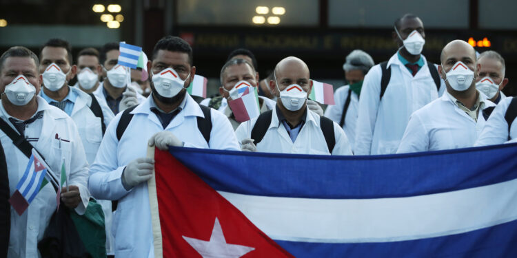 More than 50 doctors and paramedics arrived in Milan from Cuba on March 22 to help with coronavirus treatment.