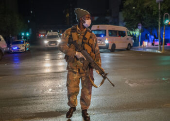 A South African soldier enforces the lockdown order in downtown Johannesburg on Friday.