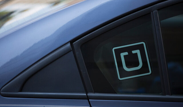 (FILES) In this file photo taken on July 09, 2019, the Uber logo is seen on a car in Washington, DC. - Uber said on May 13, 2020, it was making face masks mandatory for drivers and passengers, as part of new health and safety protocols aiming to instill confidence in the ride-hailing service as people emerge from coronavirus lockdowns. (Photo by Alastair Pike / AFP)