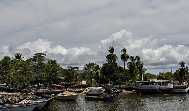 General view of a port of the town of Guiria, Sucre State, Venezuela, on March 13, 2020. - Criminal groups that take victims of human trafficking in precarious boats -which often wreck- from Guiria, in Sucre state, Venezuela, to Trinidad and Tobago, were denounced by opposition deputy Robert Alcala. (Photo by Federico PARRA / AFP)