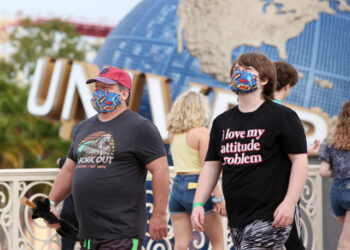 Visitors arrive at Universal Studios theme park on the first day of reopening after the shutdown during the coronavirus pandemic, on June 5, 2020, in Orlando, Florida. (Photo by Gregg Newton / AFP)