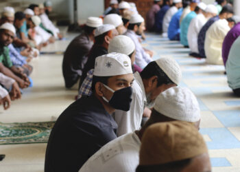 Muslims wear protective masks while offering Friday prayers (Jummah) as a preventive measure against the spread of Coronavirus at National Mosque in Dhaka. (Photo by Sultan Mahmud Mukut / SOPA Images/Sipa USA)(Sipa via AP Images)
