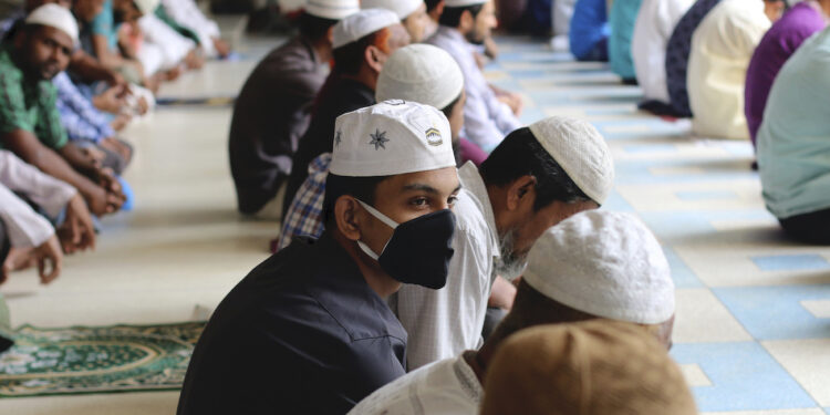 Muslims wear protective masks while offering Friday prayers (Jummah) as a preventive measure against the spread of Coronavirus at National Mosque in Dhaka. (Photo by Sultan Mahmud Mukut / SOPA Images/Sipa USA)(Sipa via AP Images)