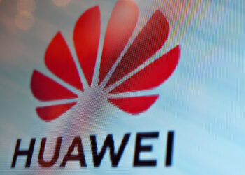 A Huawei logo is seen on a screen during the Mobile World Congress (MWC 2019) introducing next-generation technology at the Shanghai New International Expo Centre (SNIEC) in Shanghai on June 26, 2019. (Photo by Hector RETAMAL / AFP)