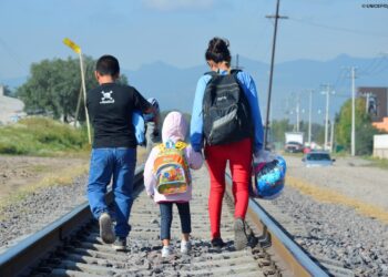 On 10 December 2014 outside of La Casa del Migrante, a catholic shelter that supports migrants near the Lechería Train Station, in the municipality of Tultitlan, State of Mexico, Maria [NAME CHANGED], 16 (on right), from Honduras travels north with her younger siblings, expecting to cross the border to the United States to reunite with her family.  Mexico, 7 July 2014 – Mexico and Central America countries are facing a very serious situation due to the increasing numbers of unaccompanied migrant children from Mexico and Central America countries arriving in the USA. According to the US government data, over 47,000 unaccompanied children have been apprehended at the southwest border in the past eight months, almost double the number apprehended between October 2012 and September 2013.