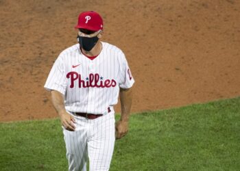 PHILADELPHIA, PA - JULY 24: Manager Joe Girardi #25 of the Philadelphia Phillies walks back to the dugout after making a pitching change in the top of the sixth inning against the Miami Marlins during Opening Day at Citizens Bank Park on July 24, 2020 in Philadelphia, Pennsylvania. The 2020 season had been postponed since March due to the COVID-19 pandemic. The Marlins defeated the Phillies 5-2.   Mitchell Leff/Getty Images/AFP