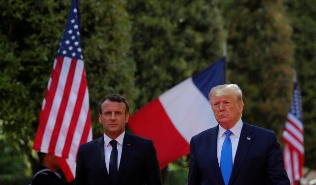 U.S President Donald Trump and French President Emmanuel Macron attend a French-American commemoration ceremony for the 75th anniversary of D-Day at the American cemetery of Colleville-sur-Mer in Normandy, France, June 6, 2019.