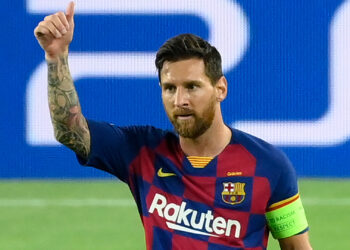 Barcelona's Argentine forward Lionel Messi celebrates after scoring a goal during the UEFA Champions League round of 16 second leg football match between FC Barcelona and Napoli at the Camp Nou stadium in Barcelona on August 8, 2020. (Photo by LLUIS GENE / AFP) (Photo by LLUIS GENE/AFP via Getty Images)