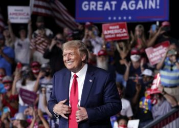 President Donald Trump stands on stage after speaking at a campaign rally at Smith Reynolds Airport, Tuesday, Sept. 8, 2020, in Winston-Salem, N.C. (AP Photo/Evan Vucci)