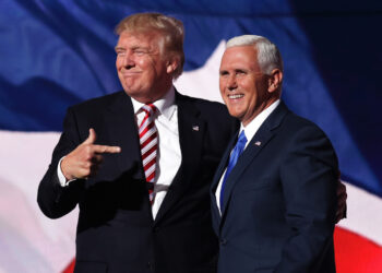 CLEVELAND, OH - JULY 20:  Republican presidential candidate Donald Trump stands with Republican vice presidential candidate Mike Pence and acknowledge the crowd on the third day of the Republican National Convention on July 20, 2016 at the Quicken Loans Arena in Cleveland, Ohio. Republican presidential candidate Donald Trump received the number of votes needed to secure the party's nomination. An estimated 50,000 people are expected in Cleveland, including hundreds of protesters and members of the media. The four-day Republican National Convention kicked off on July 18.  (Photo by Chip Somodevilla/Getty Images)