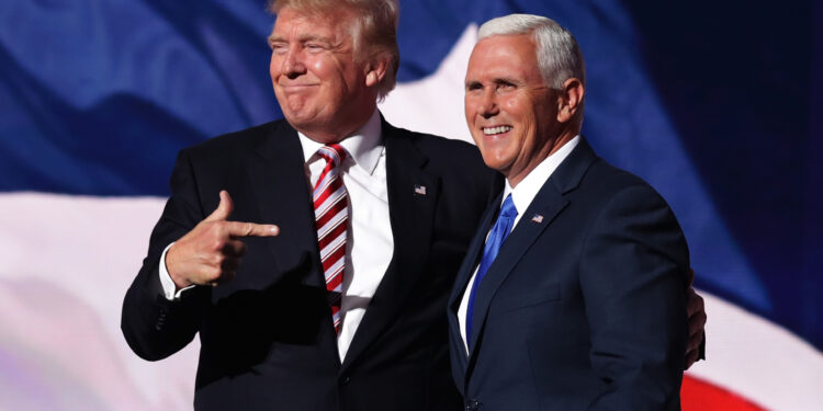 CLEVELAND, OH - JULY 20:  Republican presidential candidate Donald Trump stands with Republican vice presidential candidate Mike Pence and acknowledge the crowd on the third day of the Republican National Convention on July 20, 2016 at the Quicken Loans Arena in Cleveland, Ohio. Republican presidential candidate Donald Trump received the number of votes needed to secure the party's nomination. An estimated 50,000 people are expected in Cleveland, including hundreds of protesters and members of the media. The four-day Republican National Convention kicked off on July 18.  (Photo by Chip Somodevilla/Getty Images)