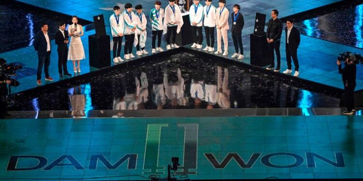 South Korea's Damwon team are seen during their award after win against China's Suning team during the League of Legends World Video Game Championships final at SAIC Pudong Football Stadium in Shanghai on October 31, 2020. (Photo by HECTOR RETAMAL / AFP)