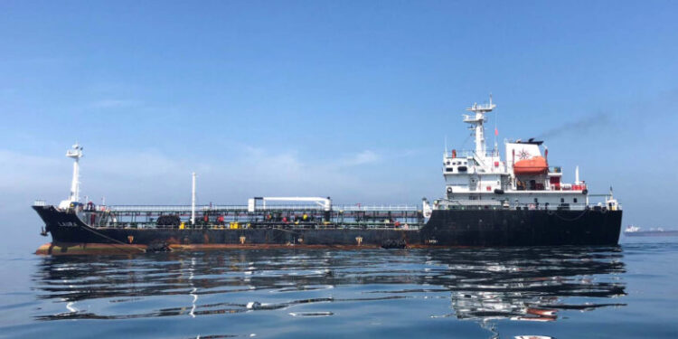 FILE PHOTO: An oil tanker is seen in the sea outside the Puerto La Cruz oil refinery in Puerto La Cruz, Venezuela July 19, 2018. Picture taken July 19, 2018. To match Special Report VENEZUELA-PDVSA/MILITARY  REUTERS/Alexandra Ulmer/File Photo