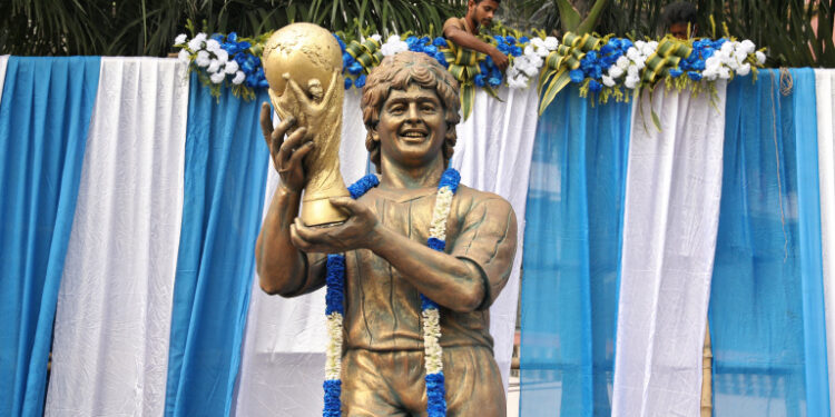 A garlanded statue of Argentine soccer great Diego Maradona is seen before a prayer meeting, in Kolkata, India, November 26, 2020. REUTERS/Rupak De Chowdhuri