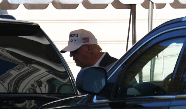 U.S. President Donald Trump enters the Presidential motorcade before traveling to an undisclosed location at the south portico of the White House in Washington, U.S., November 8, 2020. REUTERS/Tom Brenner