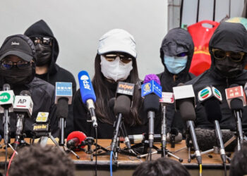 Family members of a group of Hong Kong democracy activists, who tried to flee the city by speedboat to Taiwan last August, hold a press conference in Hong Kong on December 28, 2020, the first day of their trial across the border in the Chinese city of Shenzhen. (Photo by Peter PARKS / AFP)