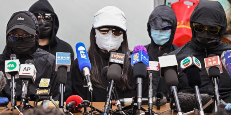 Family members of a group of Hong Kong democracy activists, who tried to flee the city by speedboat to Taiwan last August, hold a press conference in Hong Kong on December 28, 2020, the first day of their trial across the border in the Chinese city of Shenzhen. (Photo by Peter PARKS / AFP)