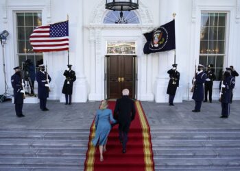 President Joe Biden and first lady Jill Biden walk up the stairs as they arrive at the North Portico of the White House, Wednesday, Jan. 20, 2021, in Washington. (AP Photo/Alex Brandon, Pool)