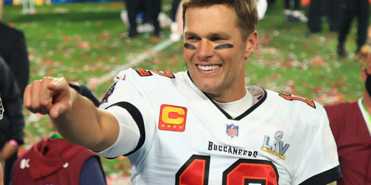 TAMPA, FLORIDA - FEBRUARY 07: Tom Brady #12 of the Tampa Bay Buccaneers celebrates after defeating the Kansas City Chiefs in Super Bowl LV at Raymond James Stadium on February 07, 2021 in Tampa, Florida. The Buccaneers defeated the Chiefs 31-9. (Photo by Mike Ehrmann/Getty Images)