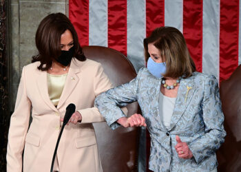 WASHINGTON, DC - APRIL 28: U.S. Vice President Kamala Harris (L) greets Speaker of the United States House of Representatives Nancy Pelosi (D-CA) ahead of U.S. President Joe Biden addressing a joint session of Congress in the House chamber of the U.S. Capitol April 28, 2021 in Washington, DC. On the eve of his 100th day in office, Biden will speak about his plan to revive America's economy and health as it continues to recover from a devastating pandemic. He will deliver his speech before 200 invited lawmakers and other government officials instead of the normal 1600 guests because of the ongoing COVID-19 pandemic. (Photo by Jim Watson - Pool/Getty Images)