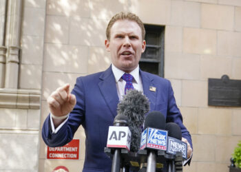 Andrew Giuliani, son of former New York Mayor Rudy Giuliani, speaks to reporters outside the building where his father lives, Wednesday, April 28, 2021, in New York. Federal agents raided Rudy Giulianiâ€™s Manhattan home and office on Wednesday, seizing computers and cellphones in a major escalation of the Justice Departmentâ€™s investigation into the business dealings of former President Donald Trumpâ€™s personal lawyer. (AP Photo/Mary Altaffer)