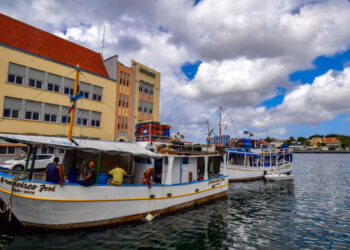 Venezuelan boats remains moored at a port in Willemstad, Curacao, Netherlands Antilles, on February 24, 2019. - In separate reports last year, Amnesty and Human Rights Watch criticized the Curacao authorities over their treatment of Venezuelan immigrants. It accused them of deporting migrants who may have a right to asylum given the dangers in their home country. It cited Venezuelans who said they had been intimidated and mistreated while in detention pending deportation in Curacao. (Photo by Luis ACOSTA / AFP)