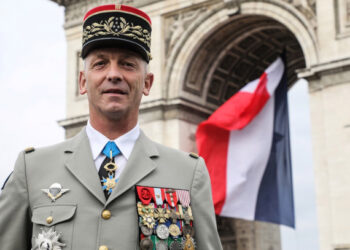 French armies chief of staff general François Lecointre pose in front of the Arc de Triomphe in the Place Charles-de-Gaulle square ontop of the Champs-Elysees avenue in Paris prior to the Bastille Day military parade on July 14, 2019. (Photo by LUDOVIC MARIN / AFP)