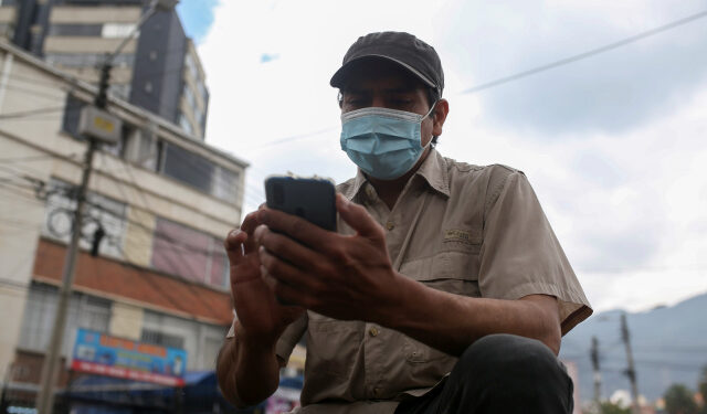 Pablo Toro, Venezuelan delivery worker uses the Valiu app from his cell phone in Bogota, Colombia June 15, 2021. Picture taken June 15, 2021. REUTERS/Luisa Gonzalez