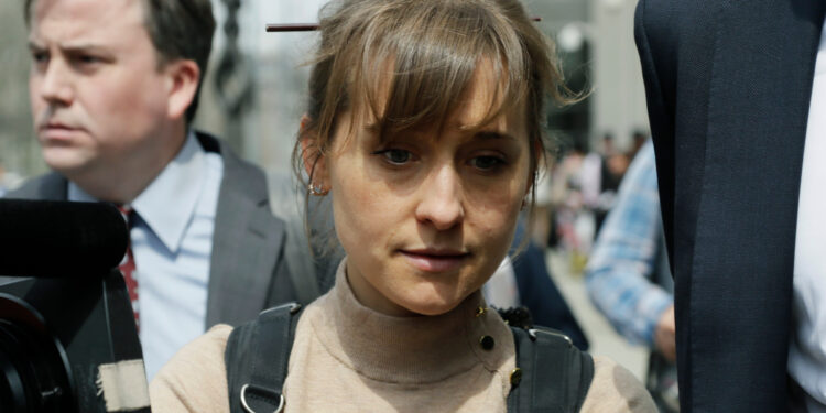 FILE - In this Monday, April 8, 2019, file photo, actress Allison Mack leaves Brooklyn federal court in New York. Mack, who played a key role in a scandal-ridden, cult-like upstate New York group, is facing sentencing Wednesday, June 30, 2021, after pleading guilty to charges she manipulated women into becoming sex slaves for the group’s spiritual leader. (AP Photo/Mark Lennihan, File)