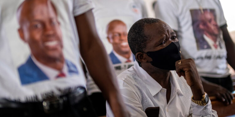 A man cries during the wake of slain Haitian President Jovenel Moise at Notre Dame Cathedral in Cap-Haitien, Haiti July 22, 2021. REUTERS/Ricardo Arduengo