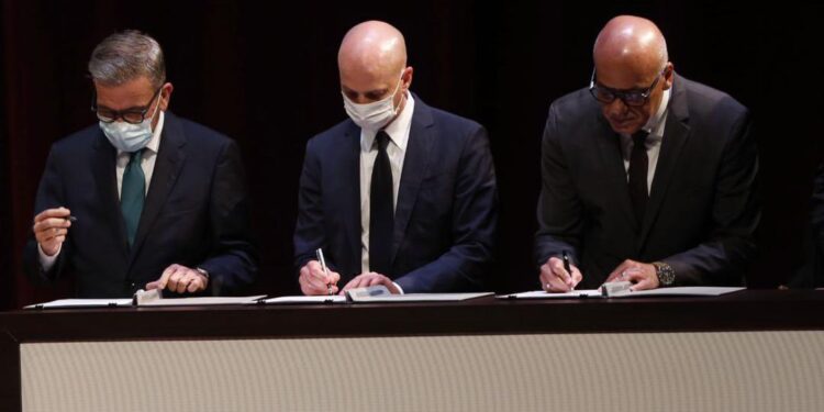 Firma memorando. Régimen de Maduro y la oposición venezolana. Foto captura.