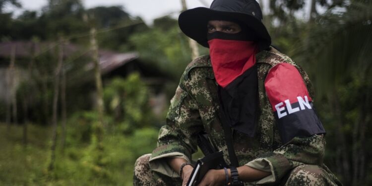 Uriel commander of the Western Front of War Omar Gomez of the National Liberation Army (ELN) guerrilla, during an interview with AFP in banks of the San Juan river, department of Choco, Colombia, on November 19, 2017. - Colombia's landmark peace deal with Marxist FARC rebels was supposed to mean peace for all but it has made little difference to indigenous and Afro-Colombian minorities, Amnesty International said on November 22, 2017. Although the agreement between the Colombian government and the FARC was signed, armed conflict is still very much the reality for millions across the country," said Salil Shetty, Secretary General at Amnesty International. (Photo by LUIS ROBAYO / AFP) / TO GO WITH AFP STORY