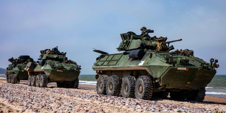 U.S. Marines with Battalion Landing Team 2/6, 22nd Marine Expeditionary Unit, prepare to board a landing craft, air cushion in light armored vehicles during BALTOPS 22 in Ventspils, Latvia, June 12, 2022. BALTOPS 22 is the premier maritime-focused exercise in the Baltic Region. The exercise, led by U.S. Naval forces Europe-Africa, and executed by Naval Striking and Support Forces NATO, provides a unique training opportunity to strengthen combined response capabilities critical to preserving freedom of navigation and security in the Baltic Sea. (U.S. Marine Corps photo by Sgt. Armando Elizalde)