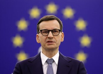 (FILES) In this file photo taken on October 19, 2021 Polish Prime Minister Mateusz Morawiecki delivers a speech during a debate on The Rule of law crisis in Poland and the primacy of EU law at the European Parliament in Strasbourg. - Poland's prime minister accused the EU of putting a "gun to our head" by demanding his country reverse judicial reforms while threatening sanctions, in an interview published in the Financial Times on October 25, 2021. (Photo by RONALD WITTEK / POOL / AFP)