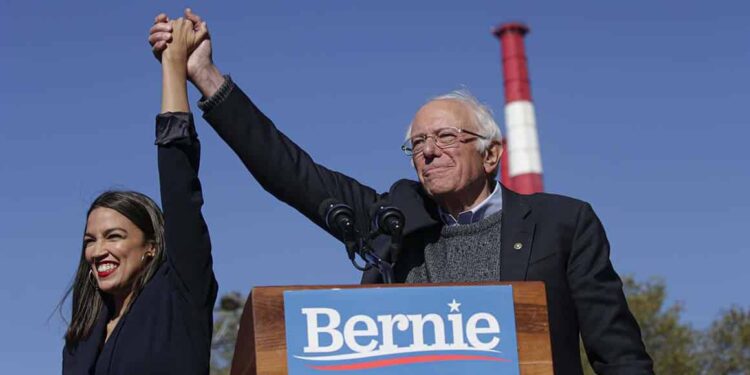 NEW YORK, NY - OCTOBER 19: Rep. Alexandria Ocasio-Cortez (D-NY) endorses Democratic presidential candidate, Sen. Bernie Sanders (I-VT) at a campaign rally in Queensbridge Park on October 19, 2019 in the Queens borough of New York City. This is Sanders' first rally since he paused his campaign for the nomination due to health problems. (Photo by Kena Betancur/Getty Images)